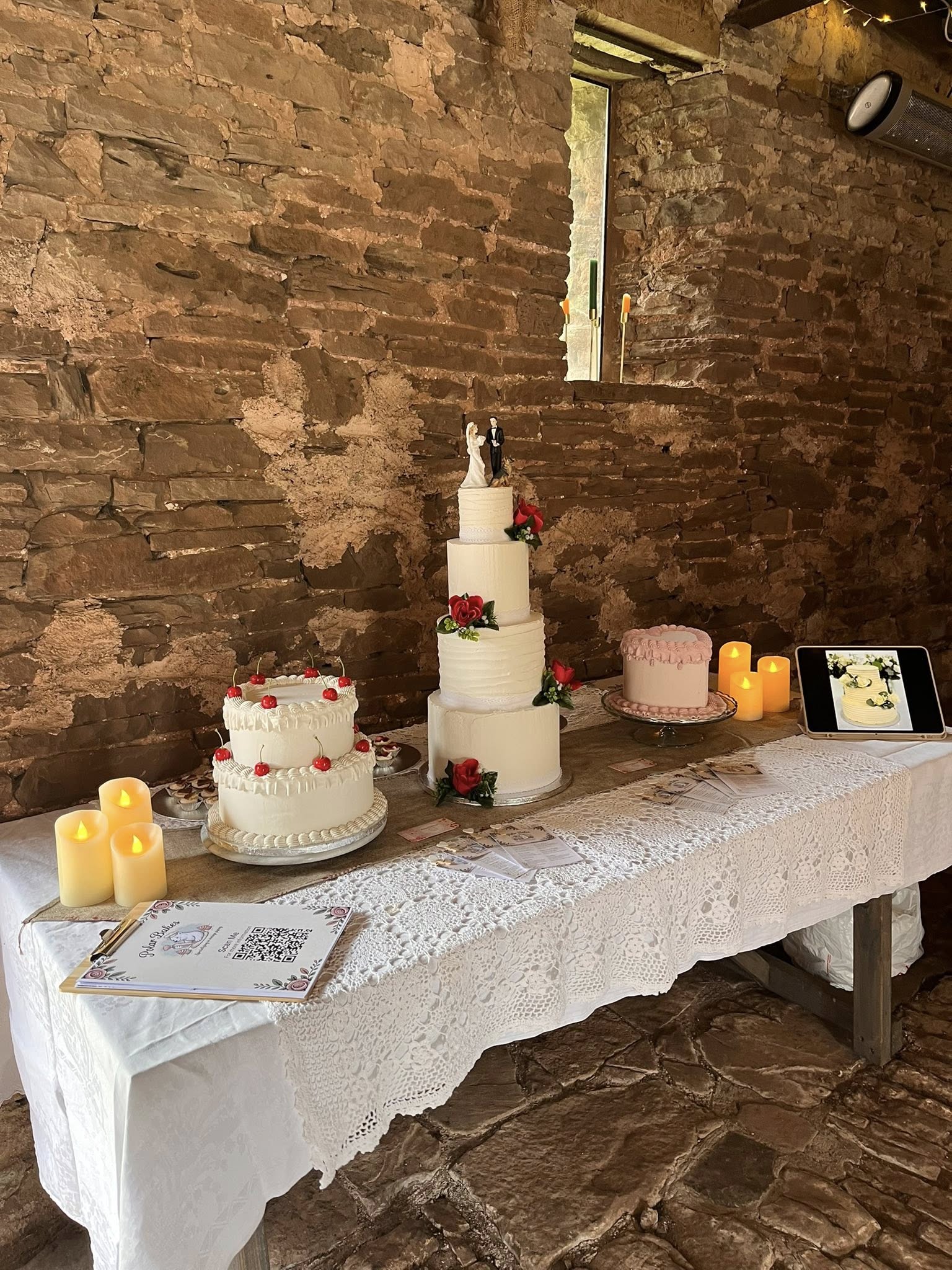 Wedding cakes displayed at a rustic venue